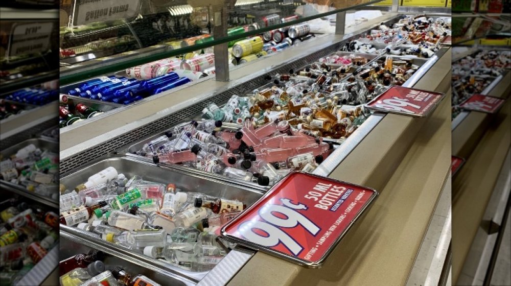 grocery store salad bar filled with liquor bottles