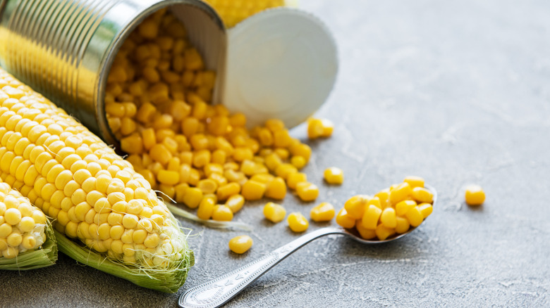 Opened metal can of corn