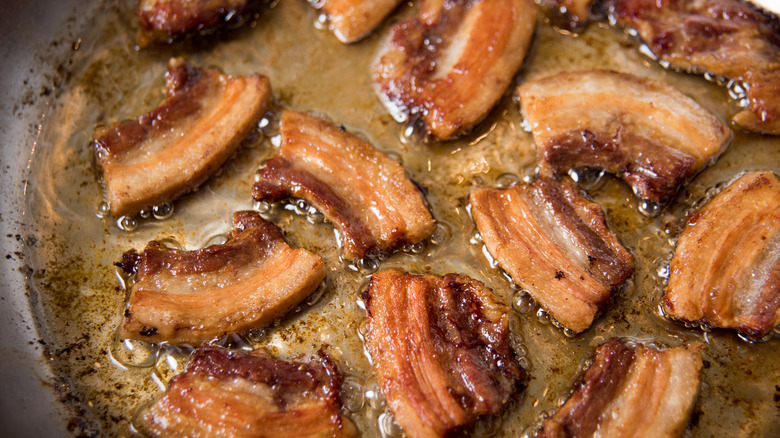 rendering the fat from pork belly in skillet