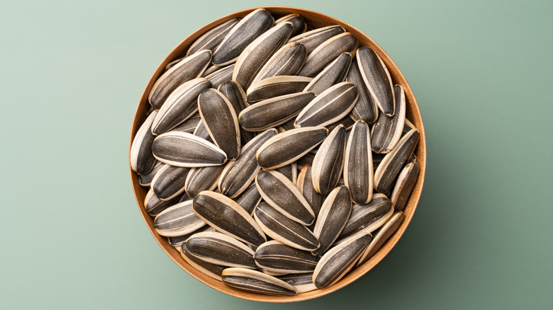 Sunflower seeds in brown bowl