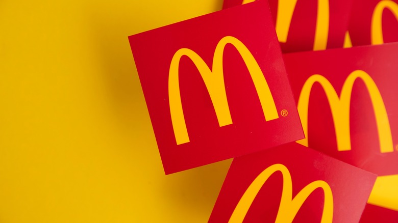 The current official golden arches logo against a yellow background