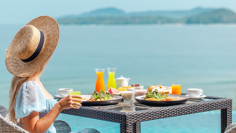 Woman eating dinner on vacation