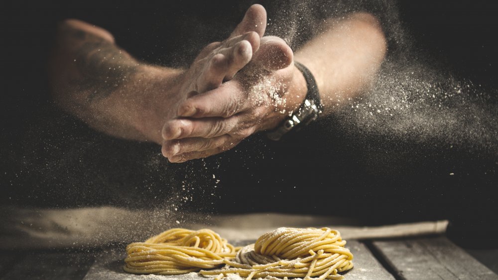 hands making pasta