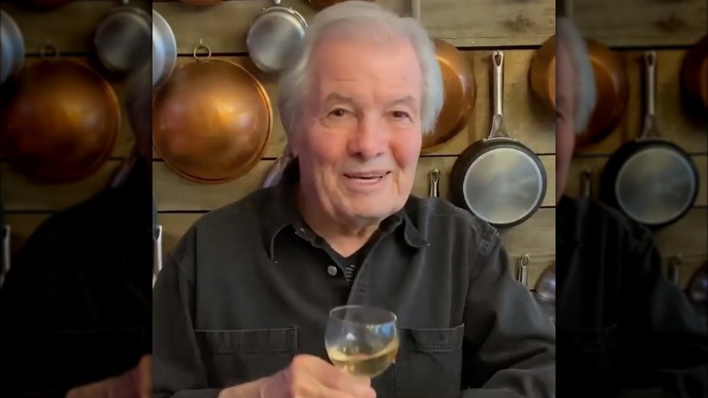 Jacques Pépin toasting with wine 