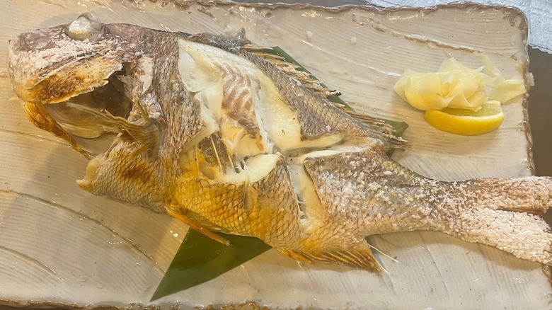 Whole grilled fish with lemon