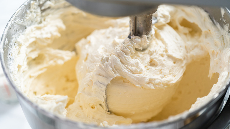 stand mixer bowl full of thick buttercream frosting