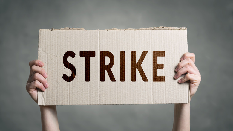 person holding strike sign