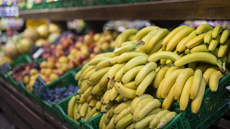 Bananas and other produce on display in grocery store