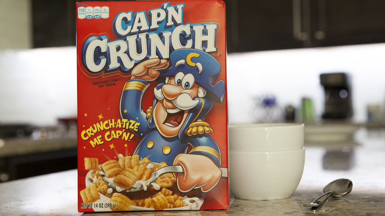 Cap'n Crunch cereal on countertop with bowls