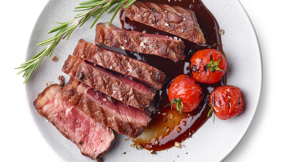 Prepared steak sliced on a plate