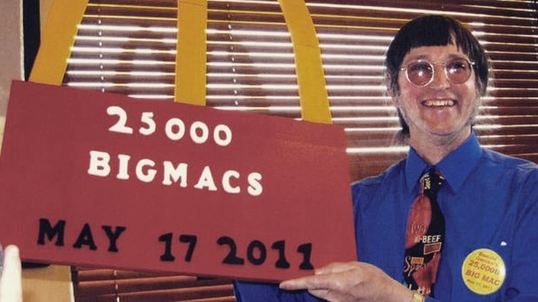 Donald Gorske holding a sign