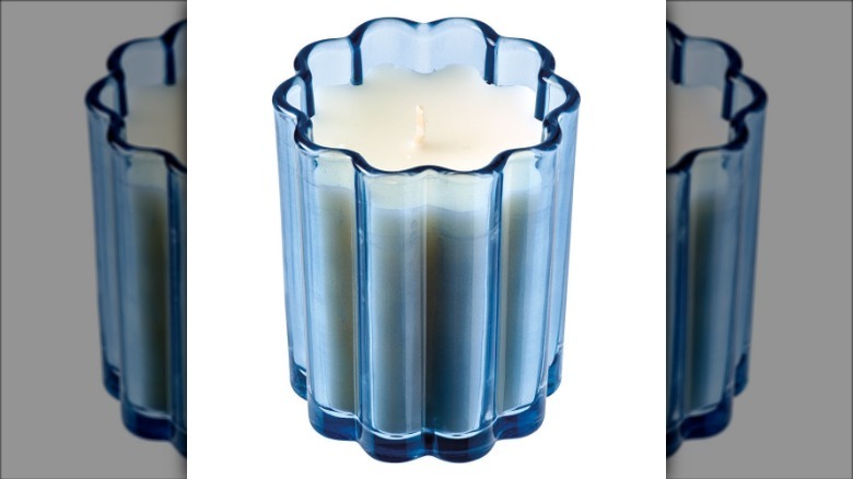 candle in blue glass jar