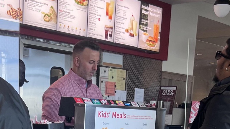 Mark Maher serving a customer at Chick-fil-A