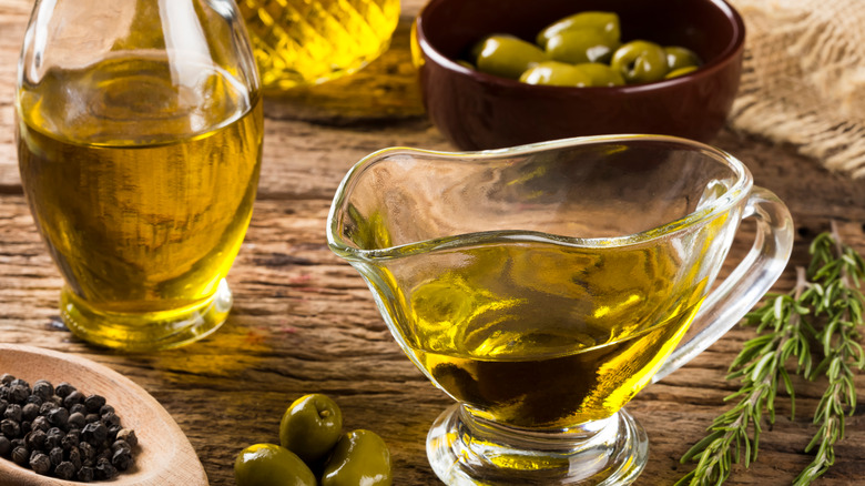 Olive oil containers with olives