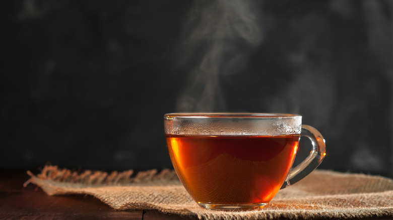 steaming tea in glass mug