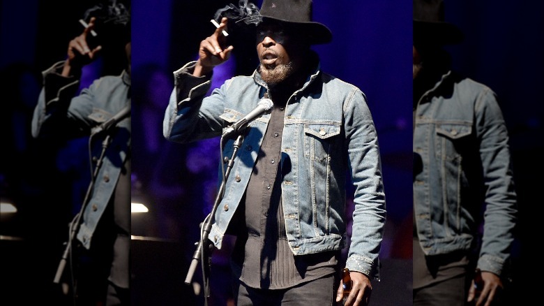 Michael K. Williams holding cigarette