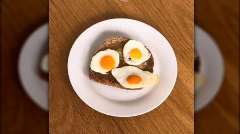 small sunny-side-up eggs on toast