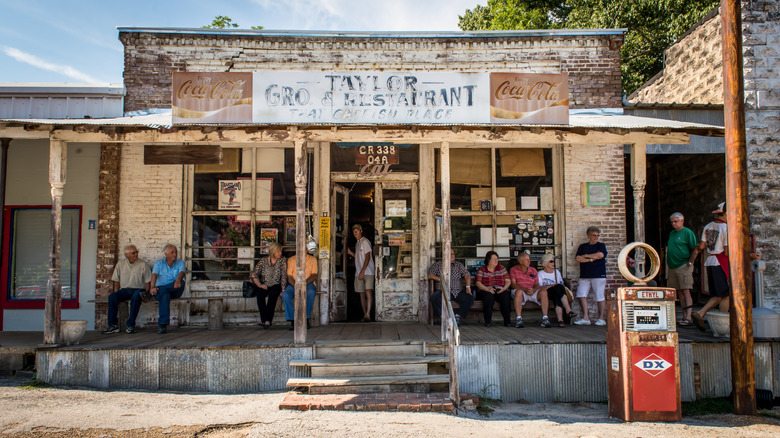 customers sitting outside Taylor Grocery