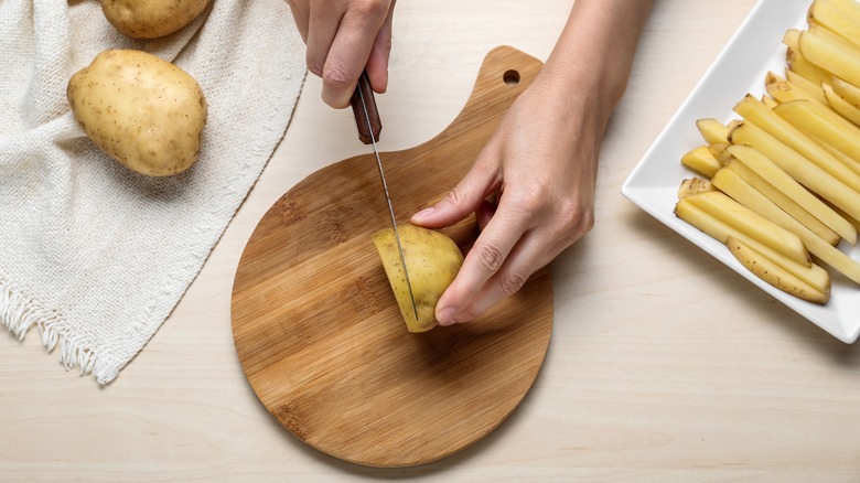 Slicing potatoes for french fries