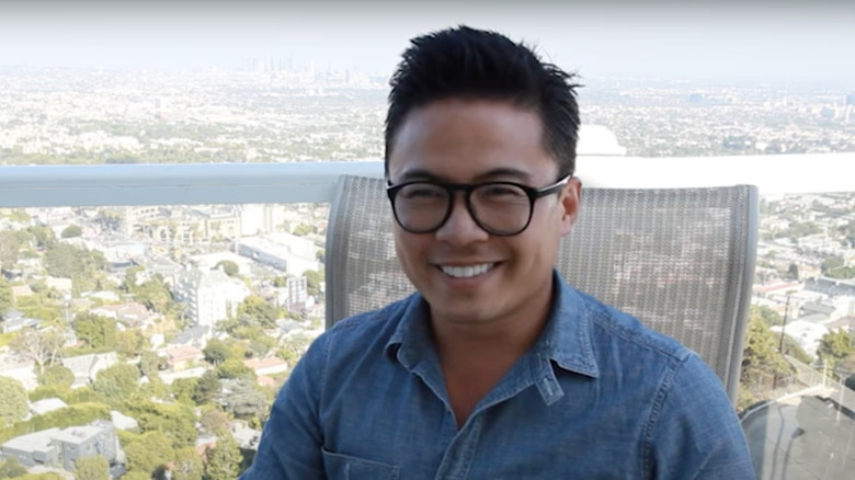 viet pham smiling on balcony