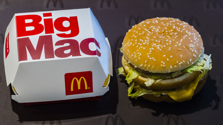 A Big Mac sandwich and sandwich container.