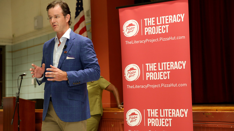 Pizza Hut president speaking at Literacy Project event