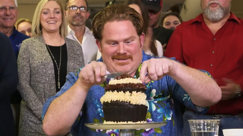 Casey Webb eating Goliath cupcake