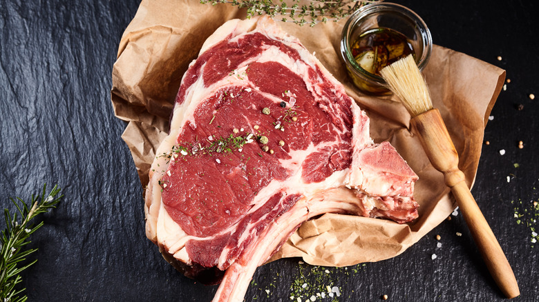 Meat being brushed with oil