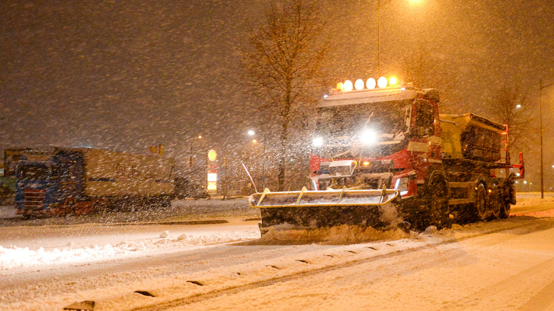 Truck de-icing during snow storm