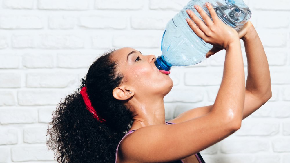 Woman drinking water gallon food challenge