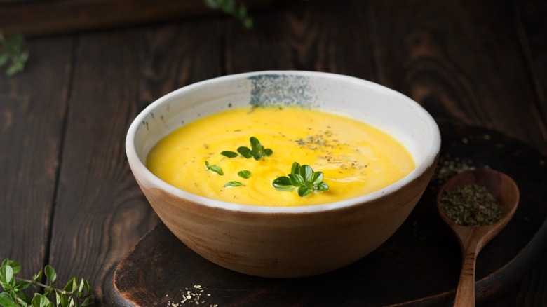 yellow soup in white bowl