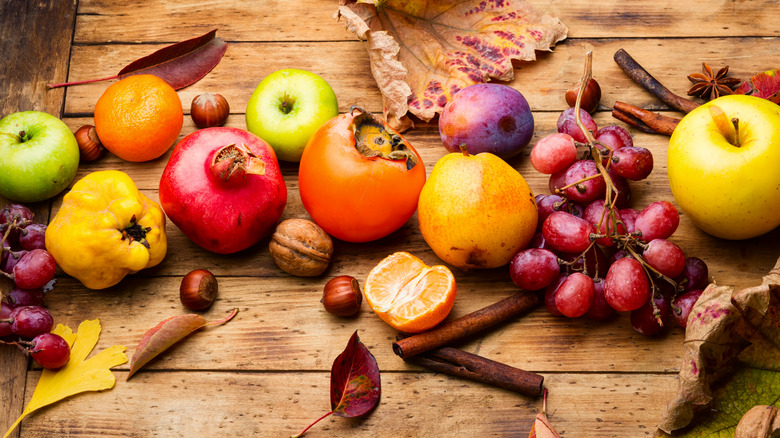 autumn harvest fruits on a wooden surface