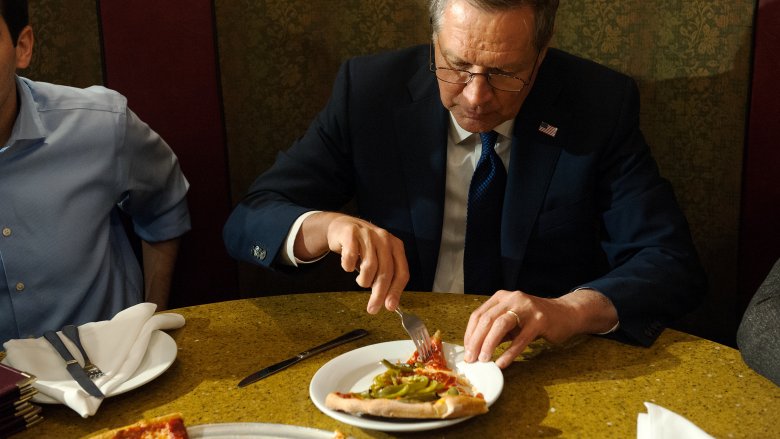 eating pizza with a fork