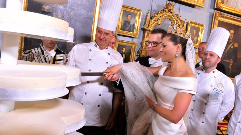 princess Victoria cutting wedding cake