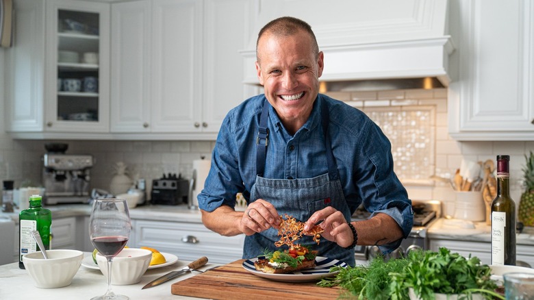 Brian Malarkey cooking and smiling