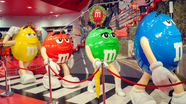 M&M character statues walking