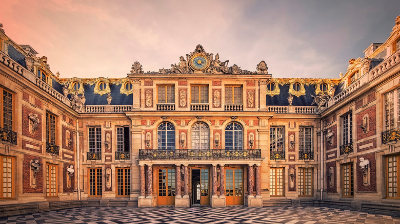 palace of versailles at sunset