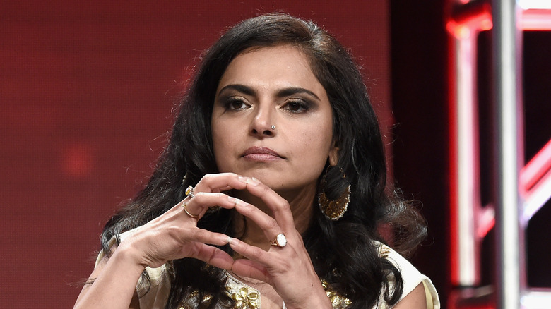 Maneet Chauhan in an interview with her fingertips pressing together