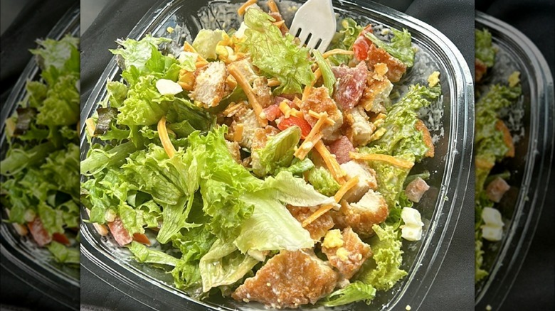 Salad with chicken, cheese, tomatoes, bacon