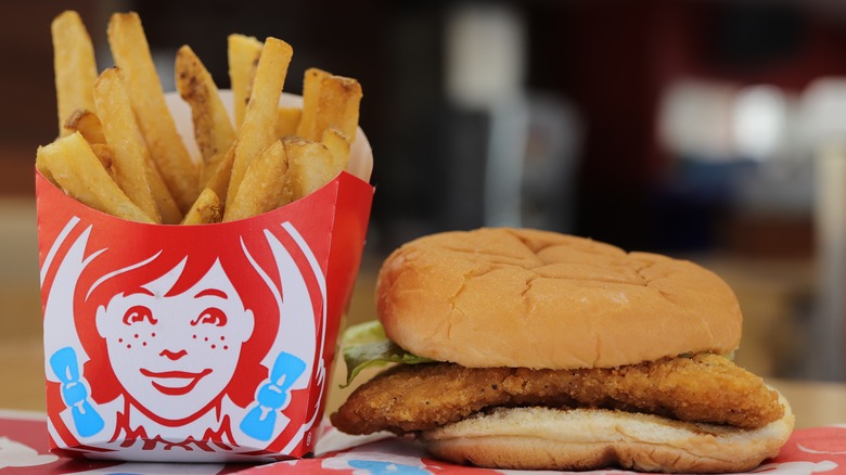 Fries in a Wendy's box next to burger