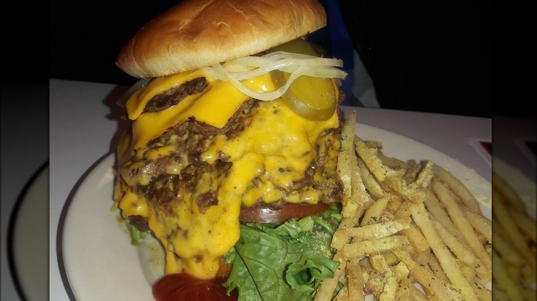 7x7 Burger on plate with fries