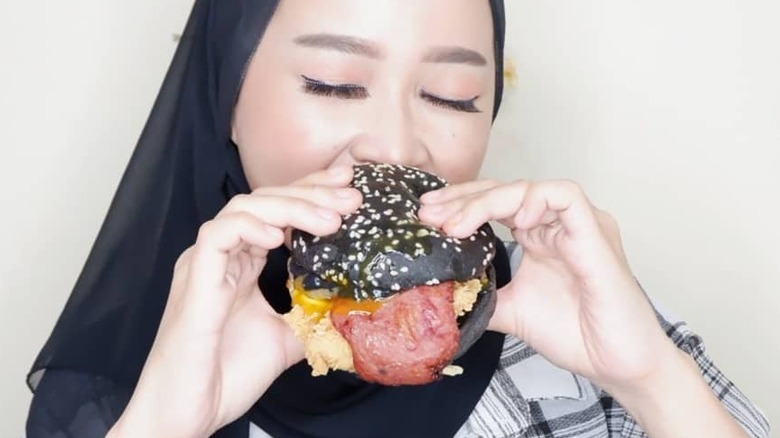 Woman posing with Ninja Burger 