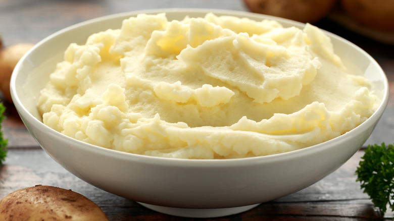 Mashed potatoes served in white bowl