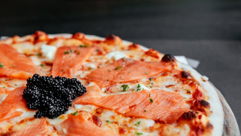 Pizza with salmon and caviar 