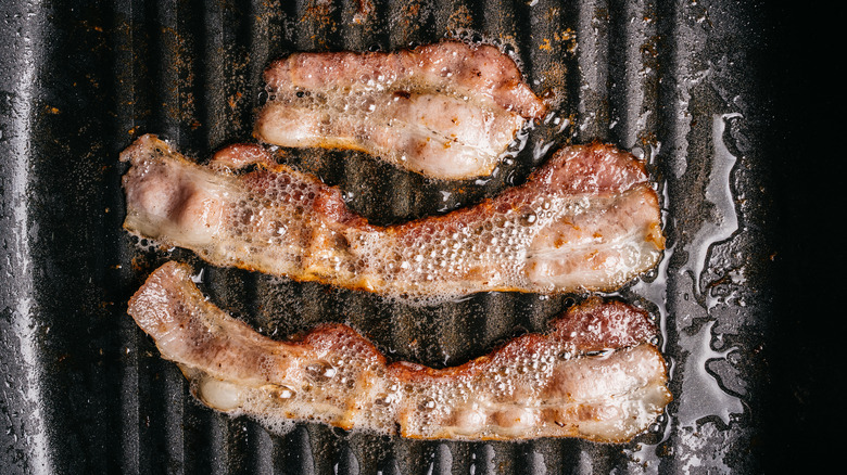 Frying bacon strips