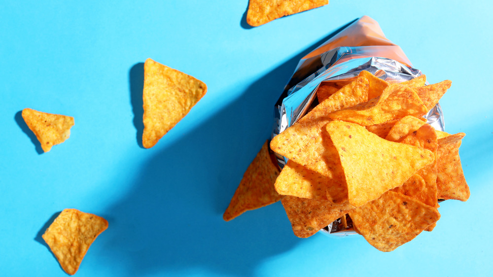 Doritos in a bag against a blue background