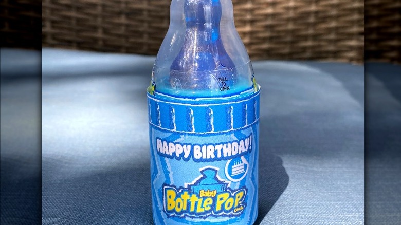 Baby Bottle Pop on a blue blanket 