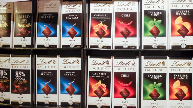 A display of lindt chocolate bars in a variety of flavors