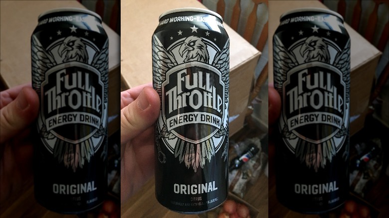 Person holding can of Full Throttle energy drink