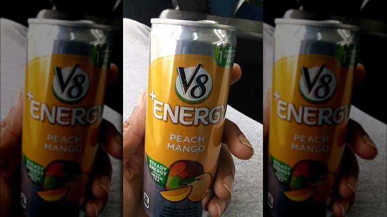 Person holding V8 Energy Drink